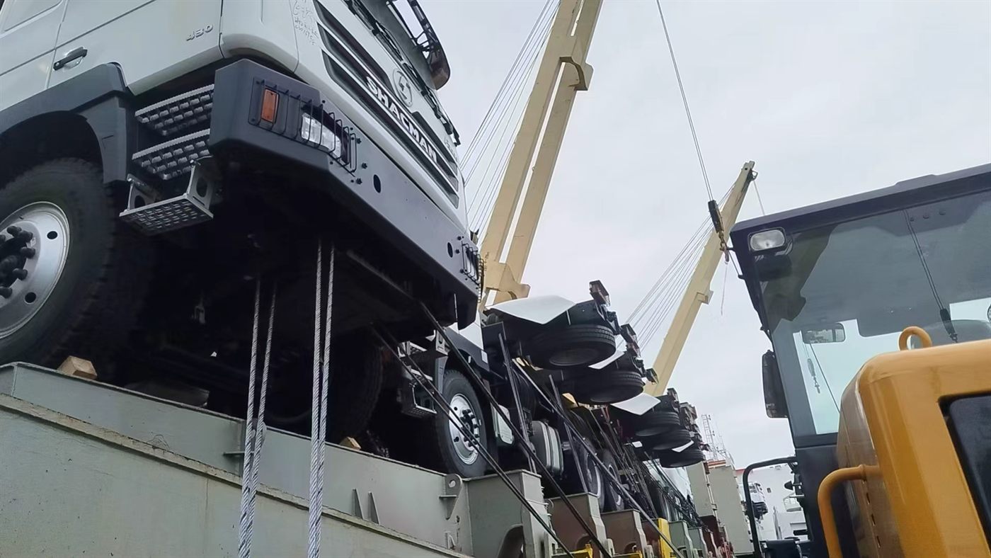 SHACMAN trucks being loaded for export shipment