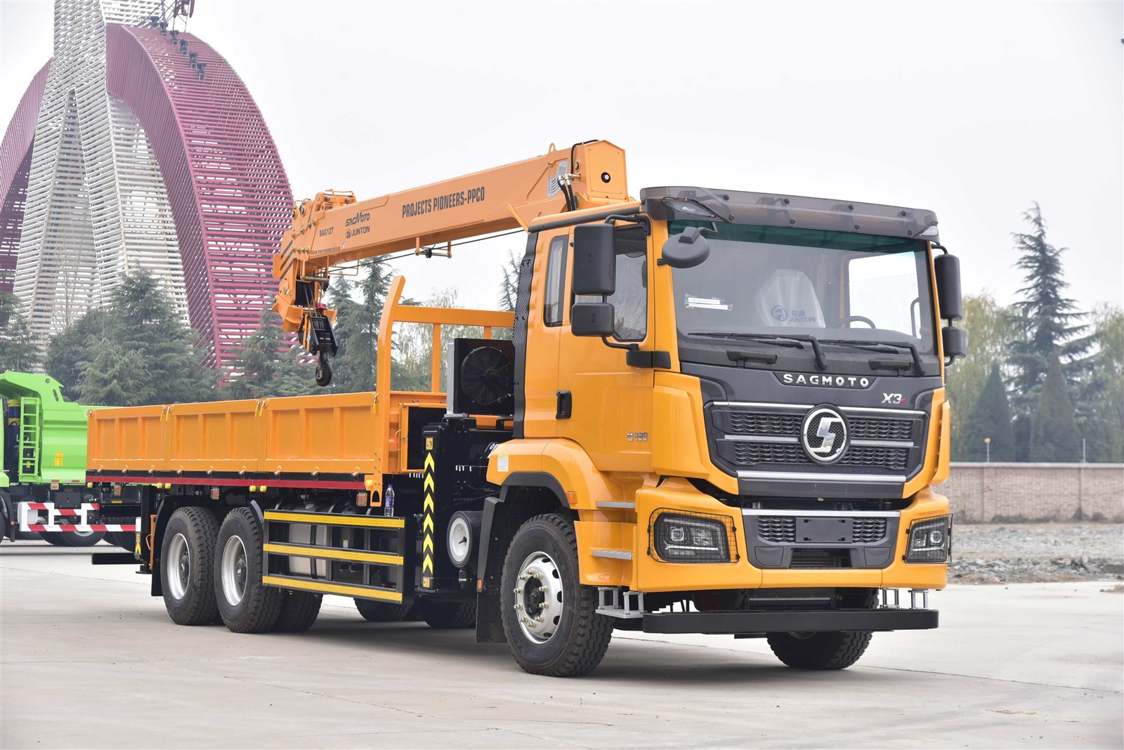 Orange SAGMOTO X3S cargo truck fitted with a knuckle boom crane