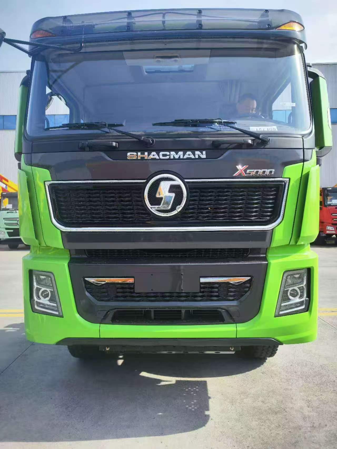 Front view of a green SHACMAN X5000 truck cab used as a model reference