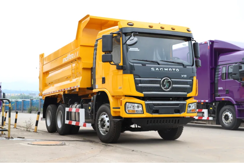 Yellow SAGMOTO X5 6x4 dump truck viewed from the front left